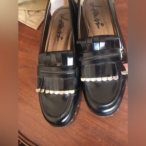 Lanvin’s shiny brown leather fringe loafers, size 10